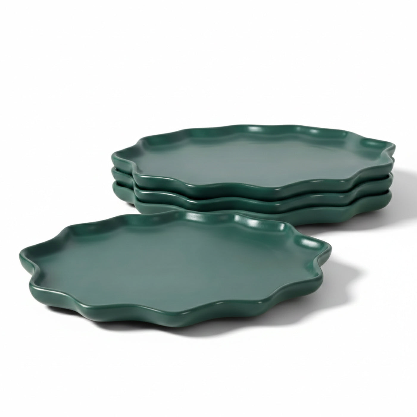 A 4-piece set of BosilunLife Forest Biome dinner plates in a matte deep green finish. Crafted from recycled eco-clay, the plates feature a unique, organic silhouette with a scalloped, wavy rim. The set is shown with three plates neatly stacked in the background and one plate in the foreground against a clean white background, highlighting a nature-inspired and sustainable tableware aesthetic.