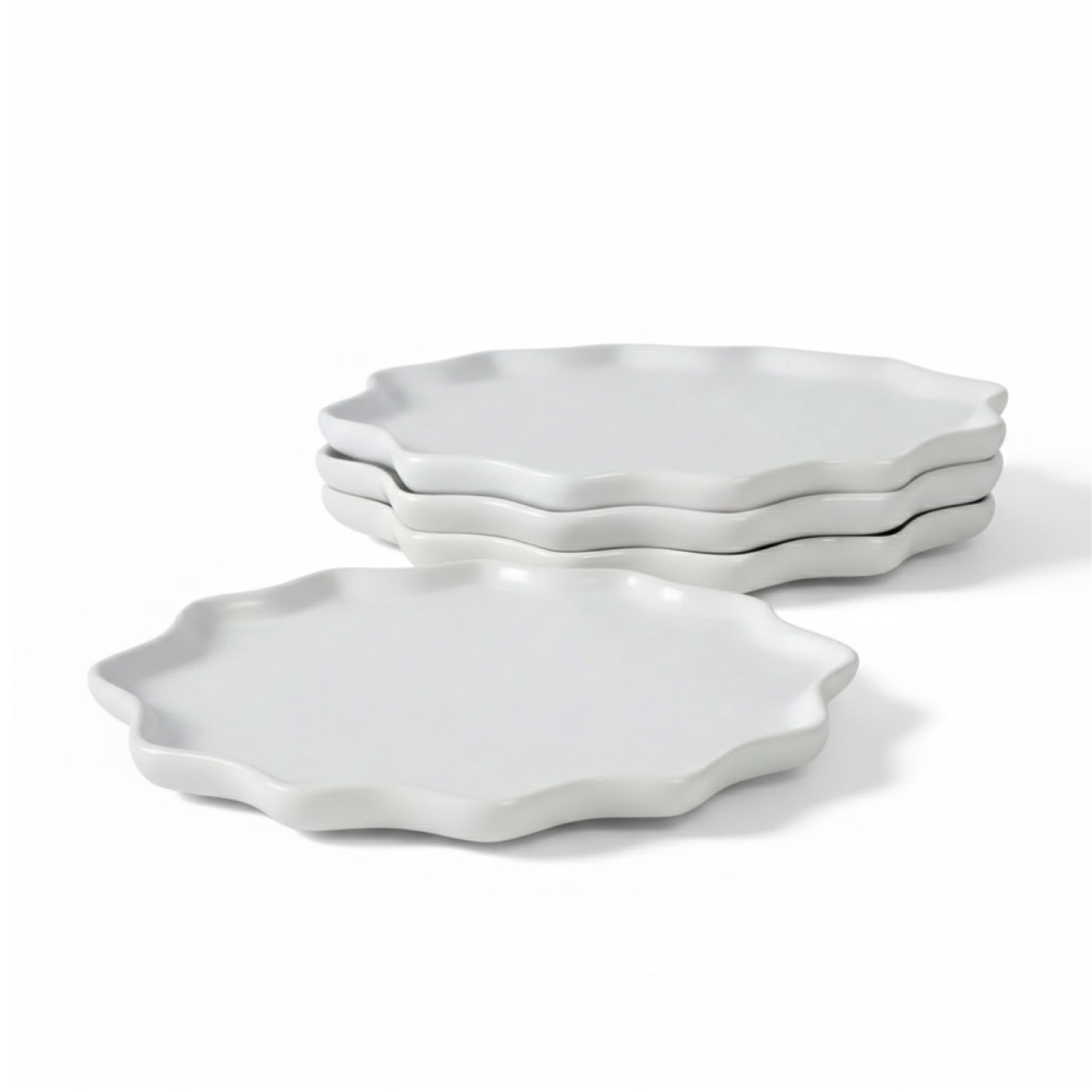 A 4-piece set of BosilunLife Forest Star dinner plates in a crisp white matte finish. Handcrafted from GRS-certified recycled eco-clay, the plates feature a unique, organic starburst silhouette with a scalloped, wavy rim inspired by forest landscapes. The set is shown with three plates neatly stacked in the background and one plate showcased in the foreground against a seamless white background, highlighting a sustainable, minimalist Scandinavian dining aesthetic.
