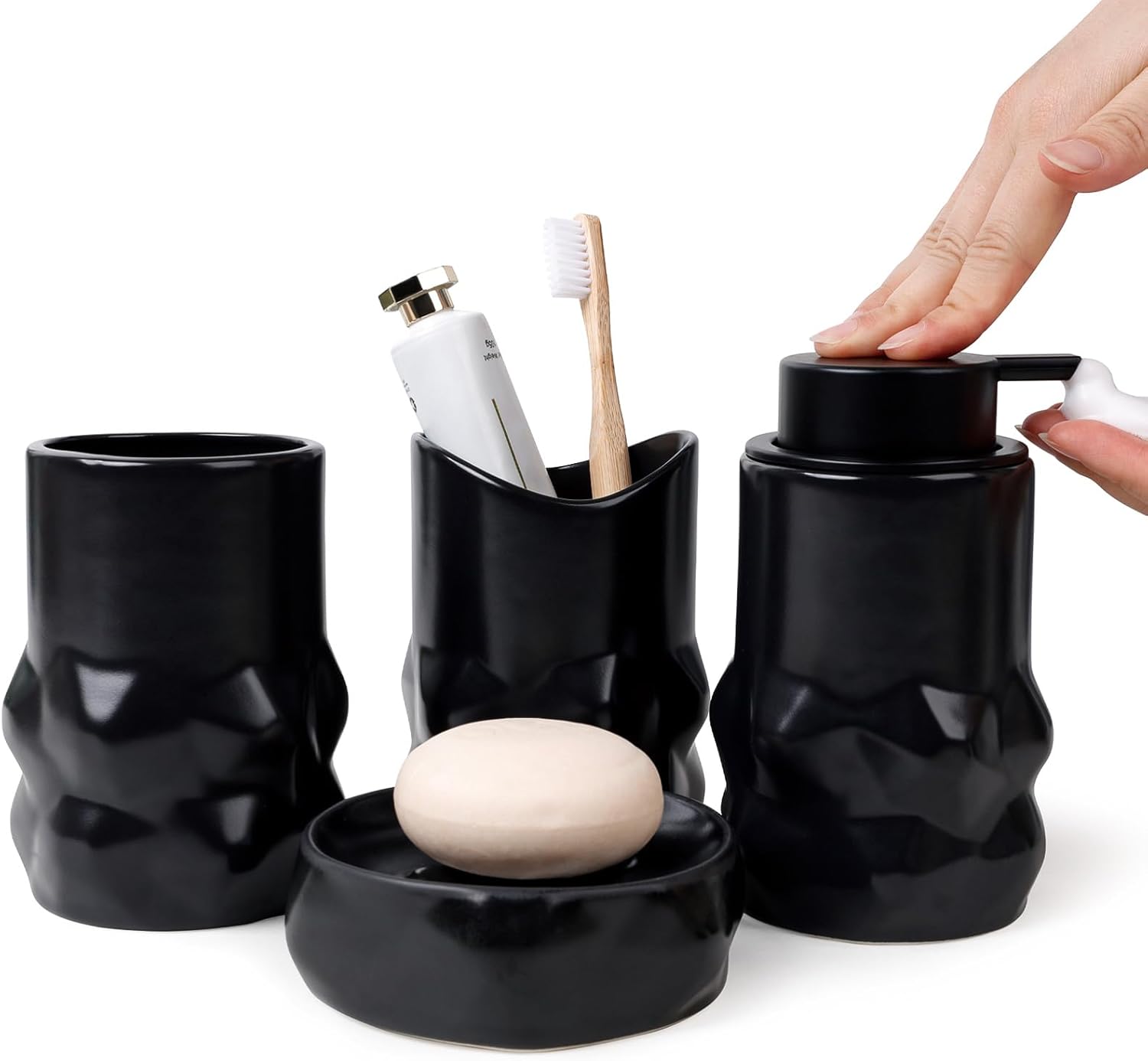 Black bathroom accessory set with toothbrush holder, soap dish, and bottle opener on a white background.