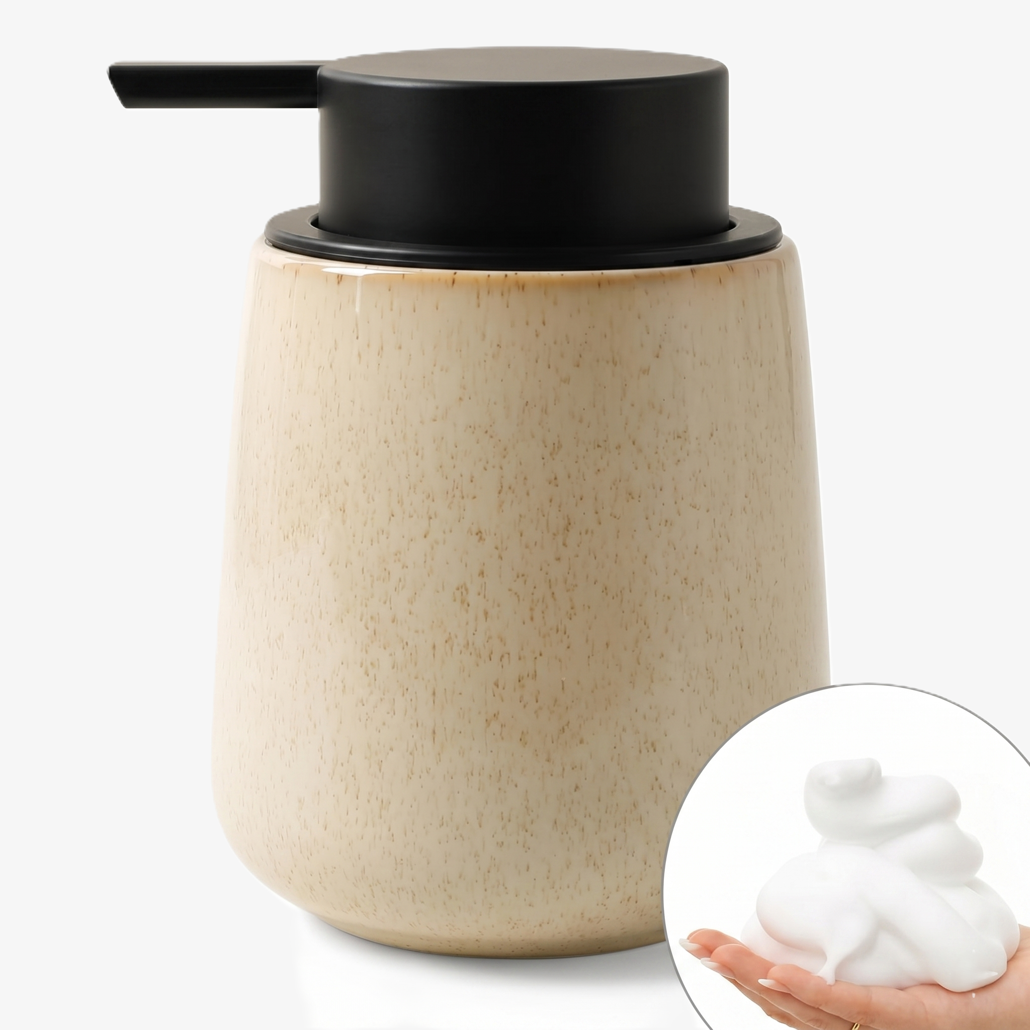 A BosilunLife eco-luxury foaming soap dispenser in a textured Greige finish, crafted from GRS-certified recycled ceramic eco-clay. The organic, rounded 12 oz (350ml) vessel features a pockmarked stone-like surface and a wide matte black pump, shown alongside a circular inset of velvety white foam in a hand. This piece embodies Scandinavian functionality and the wabi-sabi quiet balance of nature, providing a sustainable, water-saving organisation solution for a mindful washroom.