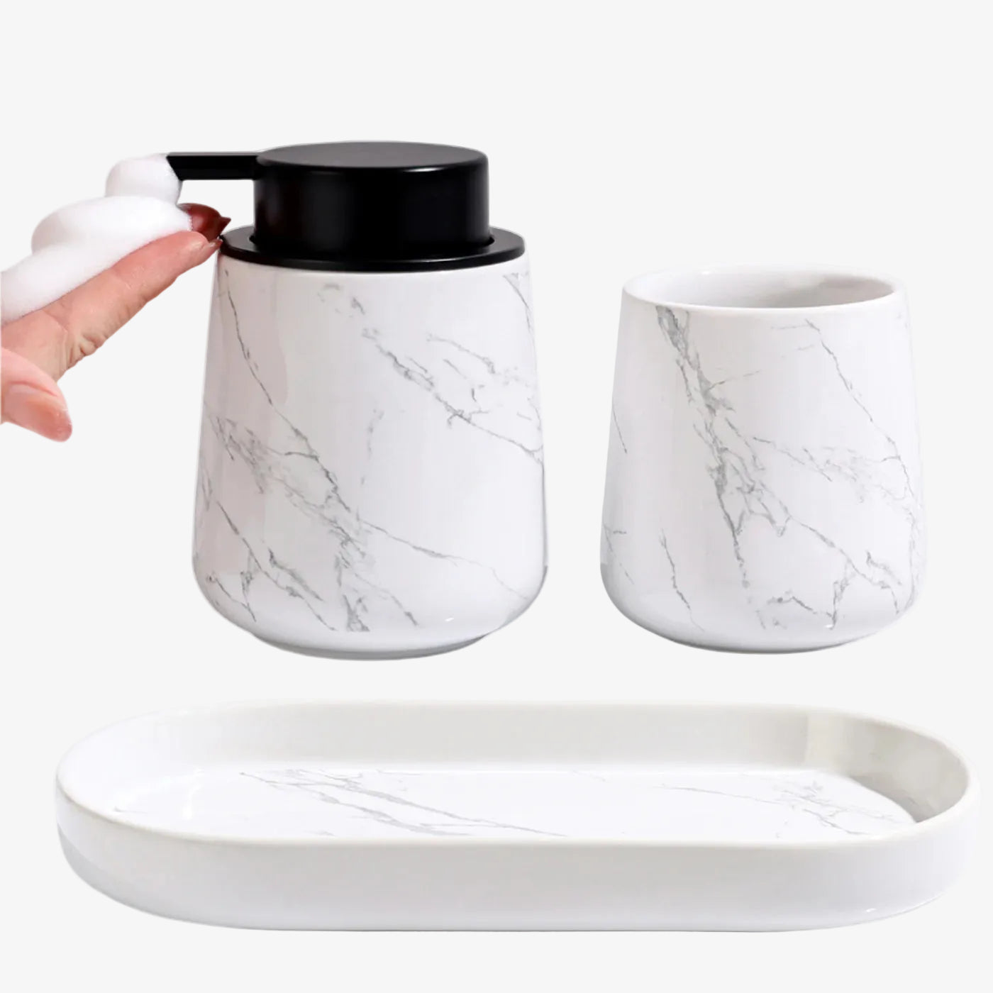 Marble-patterned ceramic set with a jar, cup, and tray on a white background