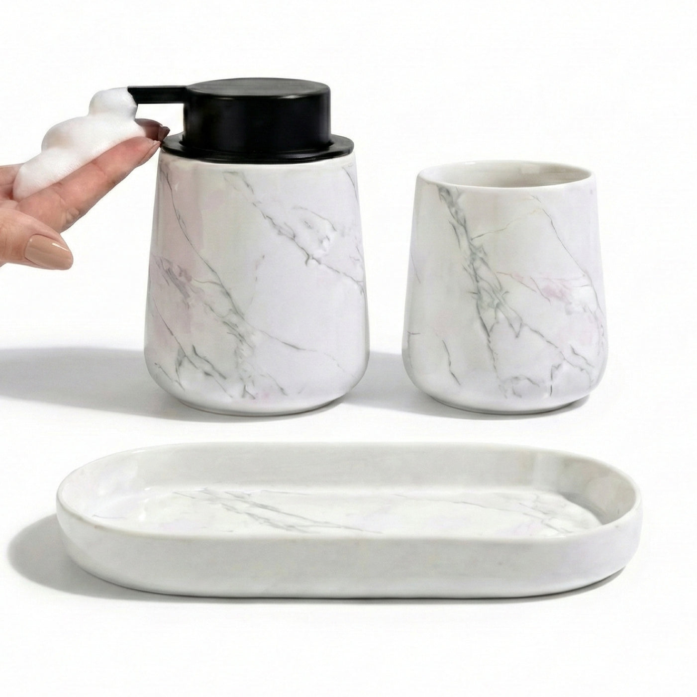 BosilunLife Marble 3-piece recycled eco-clay bathroom set featuring a foaming soap dispenser dispensing white foam into a hand, alongside a matching tumbler and oval vanity tray.