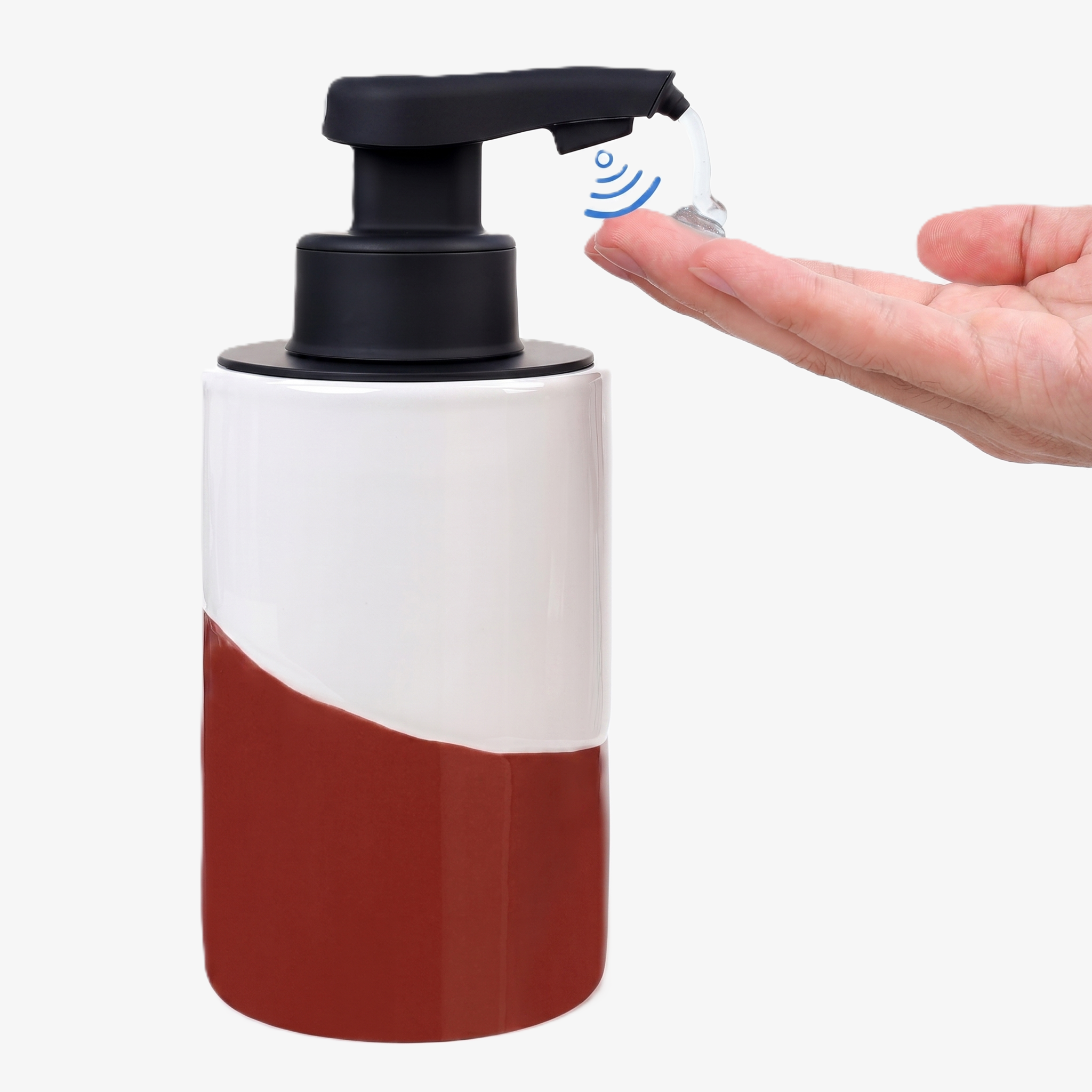A hand receiving clear liquid soap from the BosilunLife Nordic Garden automatic touchless dispenser, featuring a modern white and peach color-blocked recycled eco-clay body and a black motion-sensor pump.