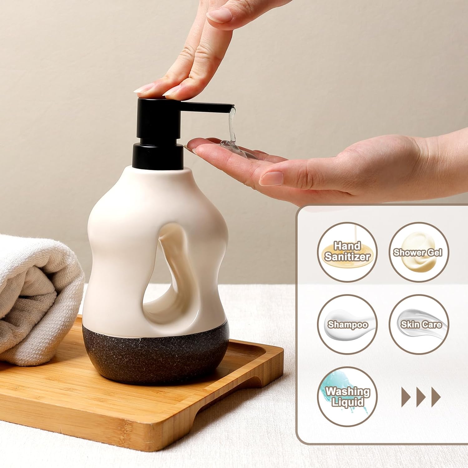 Lifestyle shot of a person using the BosilunLife Pebblebase sculptural liquid soap dispenser. Resting on a bamboo tray next to a rolled towel, the two-tone ecru and speckled dark recycled eco-clay bottle features a central cutout. A hand presses the manual black pump to dispense clear gel. An inset graphic highlights its versatile compatibility with hand sanitiser, shower gel, shampoo, skin care lotions, and washing liquid.