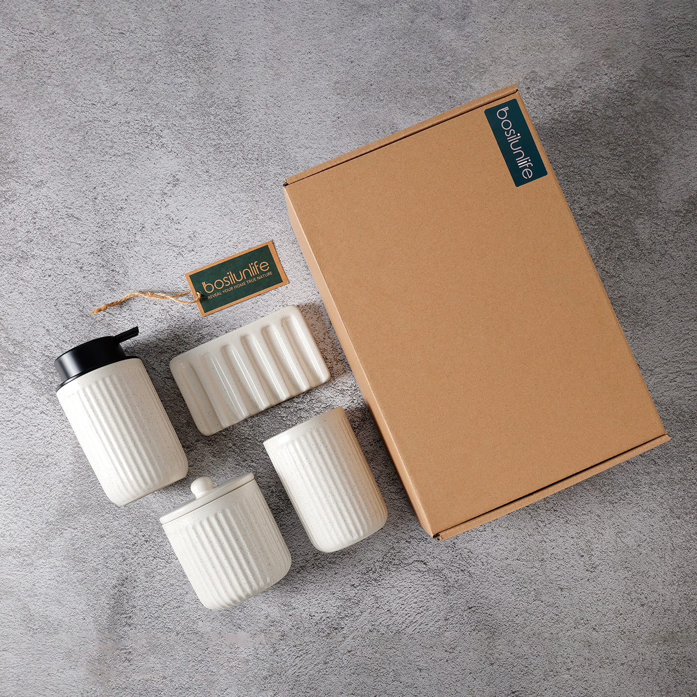 Set of white ceramic containers with a cardboard box on a gray surface, featuring 'bodum' branding.