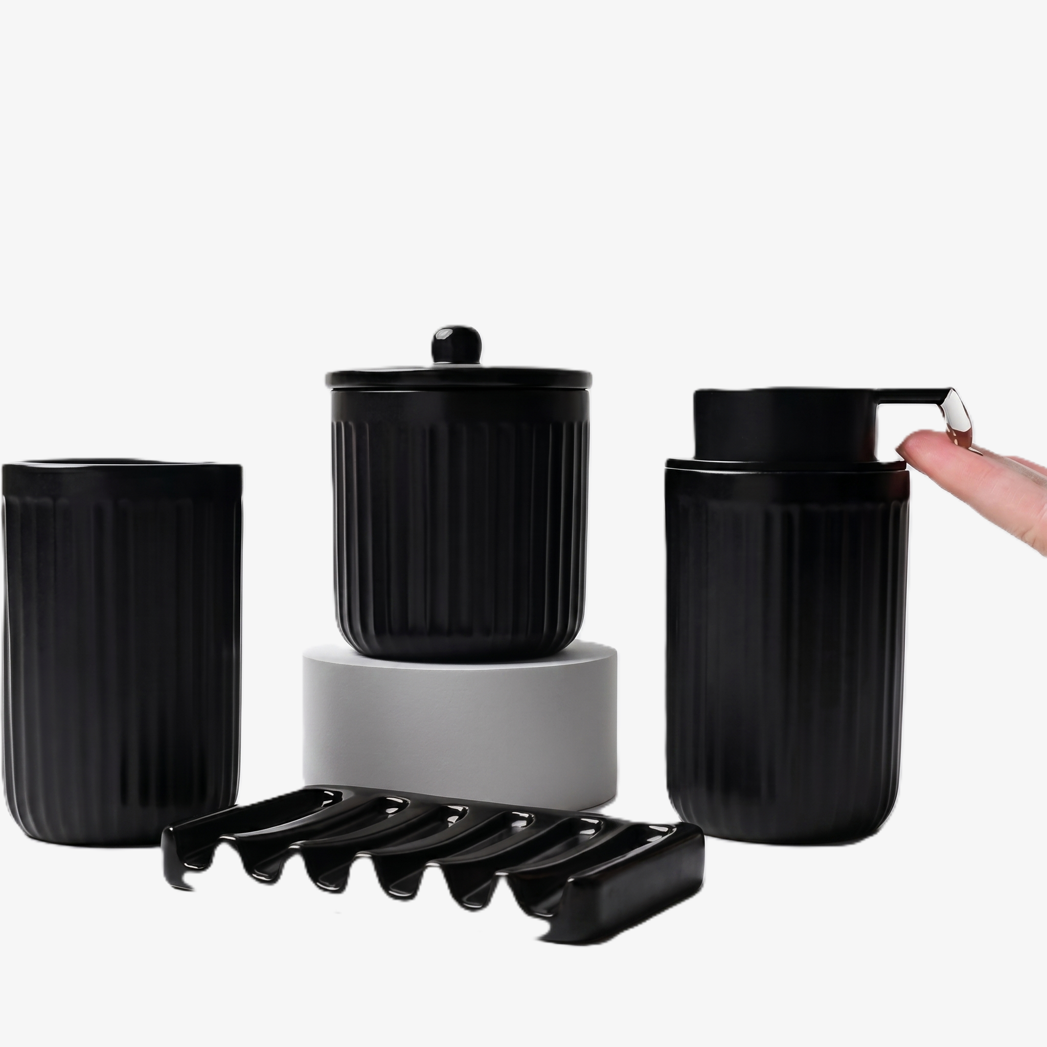 A comprehensive 4-piece BosilunLife bathroom organisation set in a monochromatic fluted black finish, crafted from GRS-certified recycled ceramic eco-clay. The ensemble features a ribbed tumbler, a coordinating lidded storage jar elevated on a minimalist grey pedestal, a wavy-ridged soap dish, and a fluted liquid soap dispenser, showing a hand catching a drop of clear liquid. This tactile 'Architectural Noir' design reflects Scandinavian functionality.