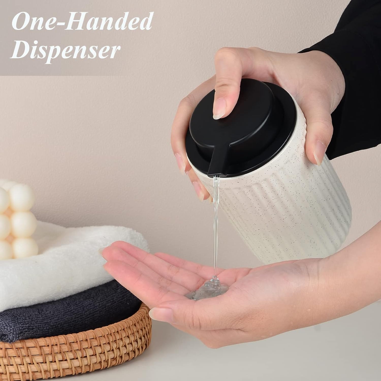 Lifestyle demonstration of the one-handed BosilunLife 12 oz liquid soap dispenser. A person easily presses the large matte black pump with one hand to dispense a clear gel soap, highlighting the ergonomic, easy-press design of the speckled beige recycled eco-clay bottle.