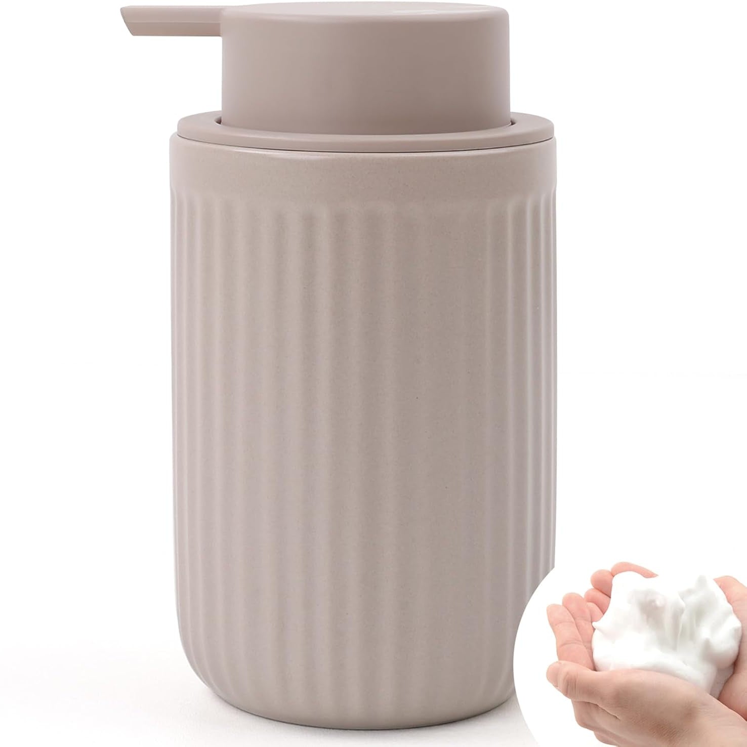 Beige soap dispenser with hands holding a bar of soap on a white background