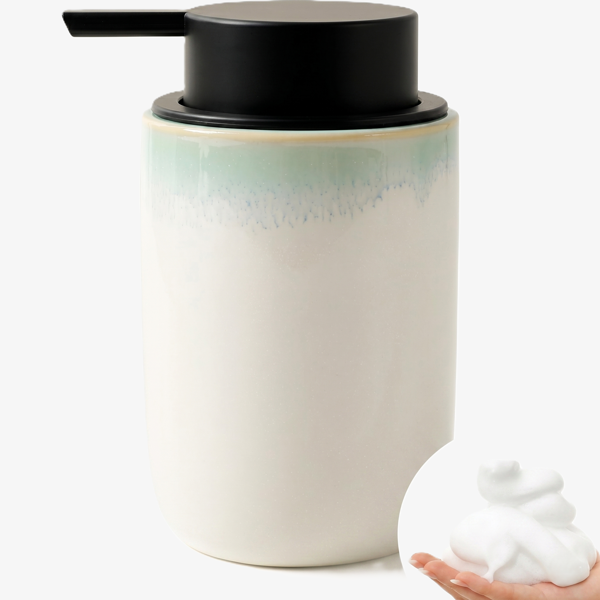 Primary product shot of the BosilunLife 12 oz (350ml) slim foaming soap dispenser featuring a white recycled ceramic base with a reactive blue-glazed rim. The slender organic vessel is topped with a contrasting matte black wide-head foaming pump, with an inset image of a hand holding a mound of rich, velvety white foam to demonstrate the mechanism. Crafted from GRS-certified eco-clay.