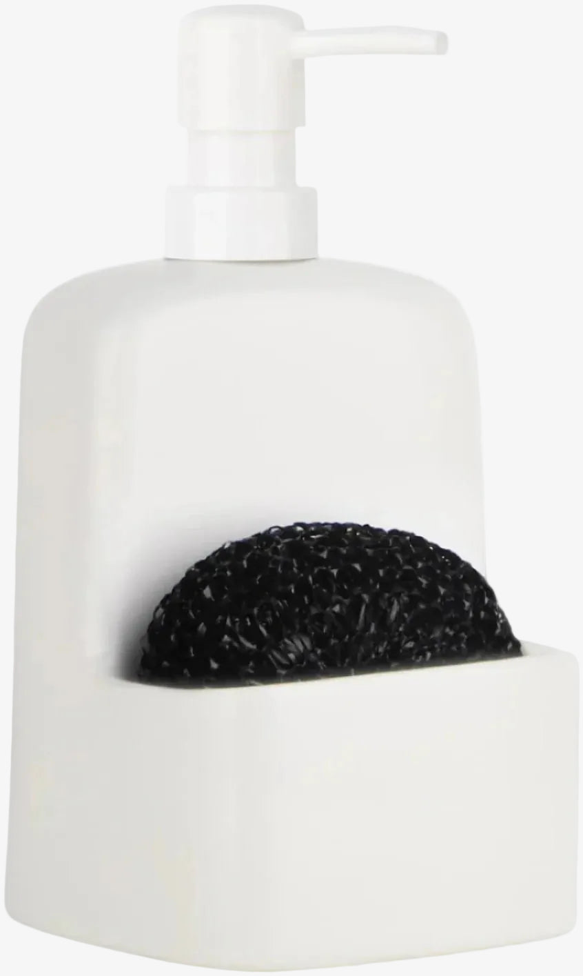 White ceramic soap dispenser with black scrubber on a white background