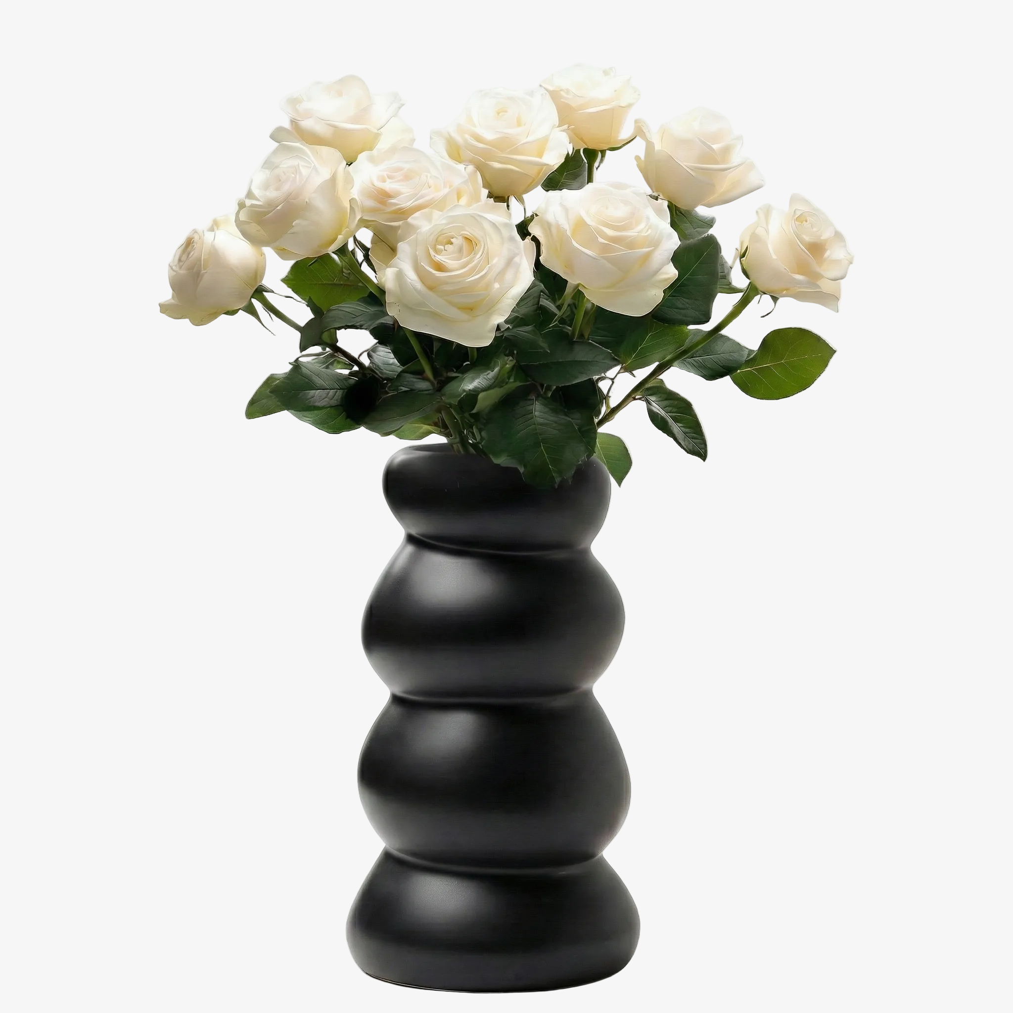 BosilunLife Stacked Bubble Flower Vase in matte black recycled eco-clay. The sculptural, four-tier chubby ceramic vase is filled with a fresh bouquet of crisp white roses against a seamless white background, creating a striking, high-contrast centrepiece for modern home décor.