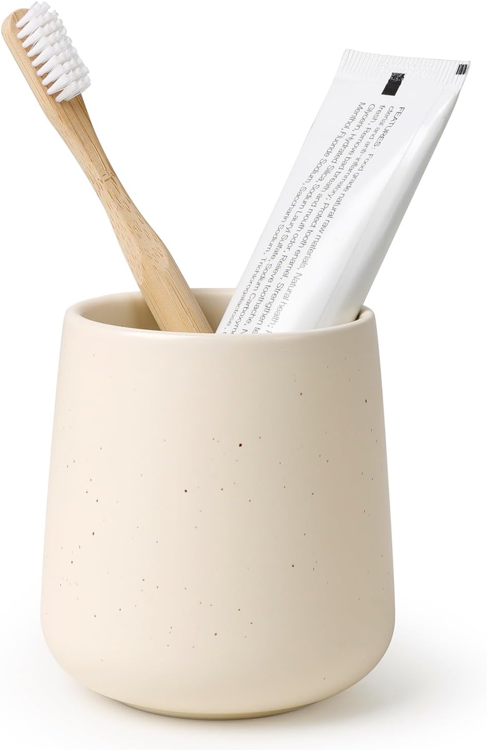 BosilunLife eco-luxury bathroom tumbler and toothbrush holder in a speckled sand finish. Crafted from GRS-certified recycled ceramic eco-clay, the piece features an organic rounded silhouette that balances Scandinavian functionality with the quiet harmony of nature. Styled with a sustainable bamboo toothbrush and white toothpaste tube, it showcases intentional design and a commitment to a circular economy and planetary responsibility.