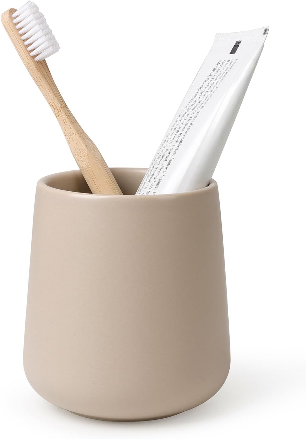 BosilunLife eco-luxury bathroom tumbler and toothbrush holder in a smooth matte tan finish. Crafted from GRS-certified recycled ceramic eco-clay, the organic rounded silhouette balances Scandinavian functionality with the quiet harmony of nature. Styled with a sustainable bamboo toothbrush and white toothpaste tube, it represents intentional design and a commitment to the circular economy and a sustainable world.