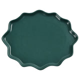 An irregularly shaped green dinner plate