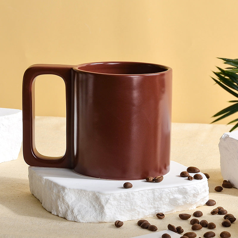 Reddish brown ceramic mug with square handle