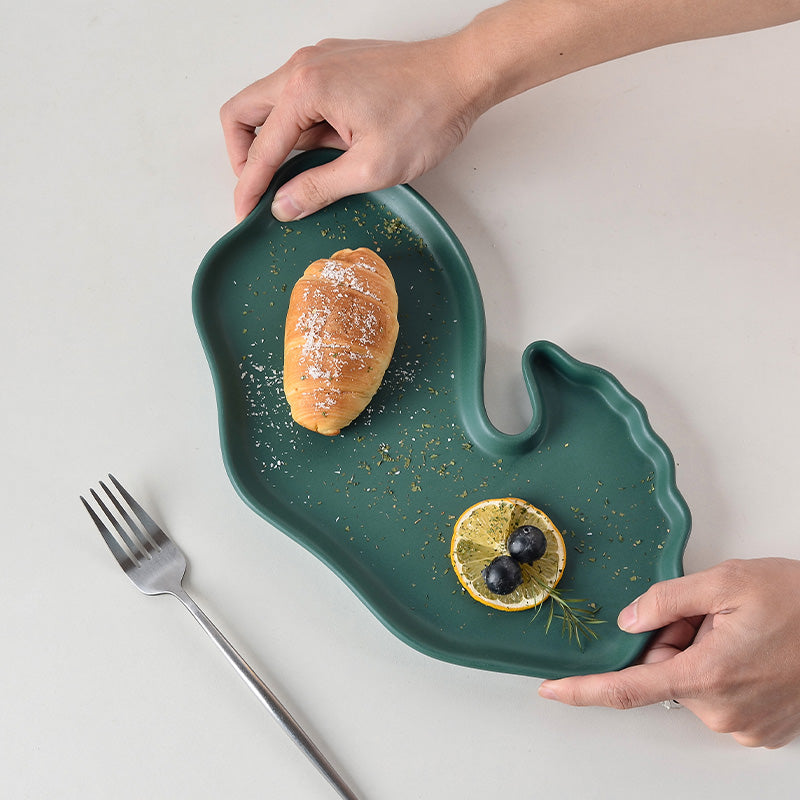 A ceramic dinner plate with bread