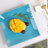 Blue ceramic square dinner plate with fruits