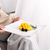 White square ceramic plate with fruit.