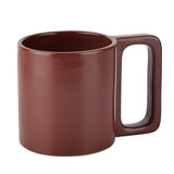 A reddish brown ceramic mug
