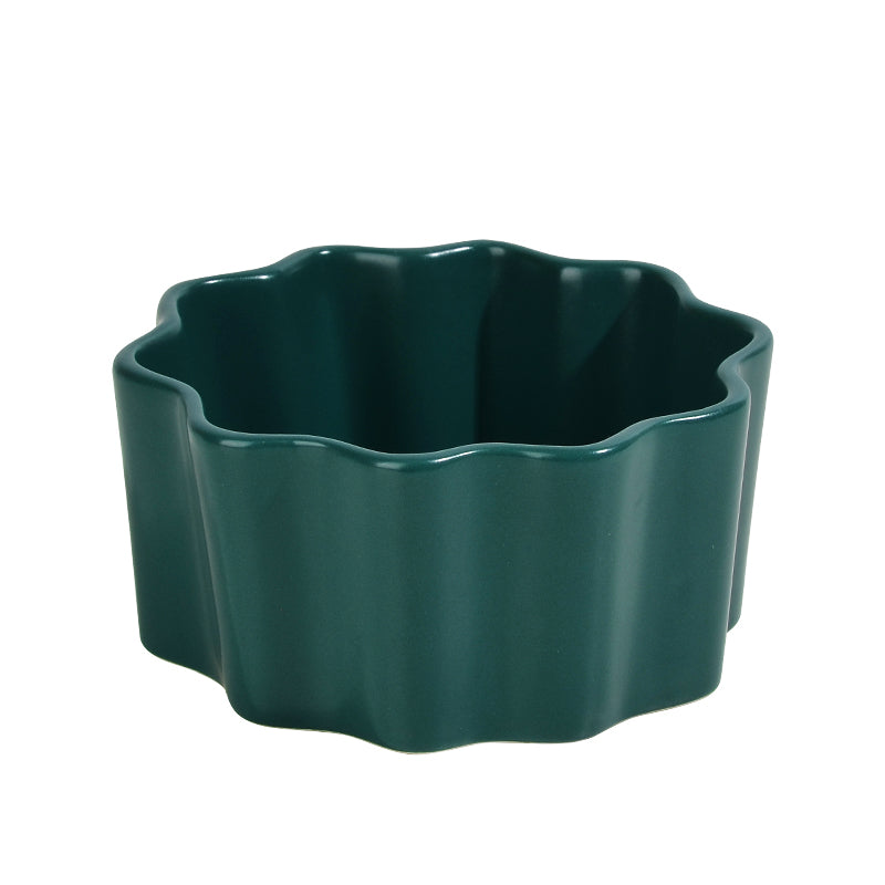 A green ceramic bowl