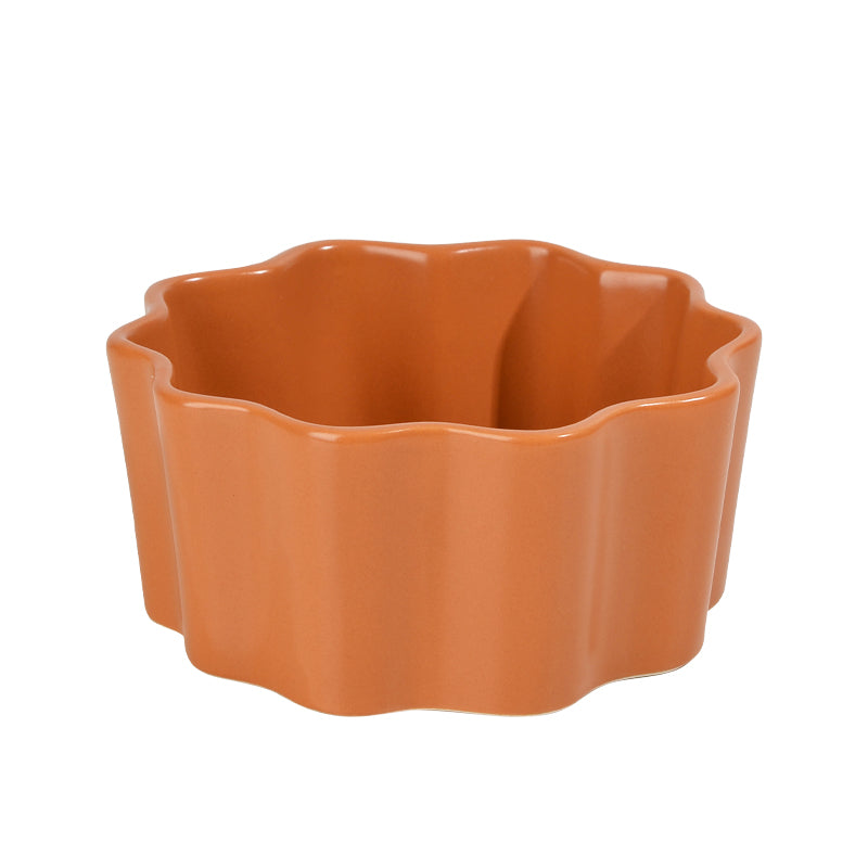 An orange ceramic bowl