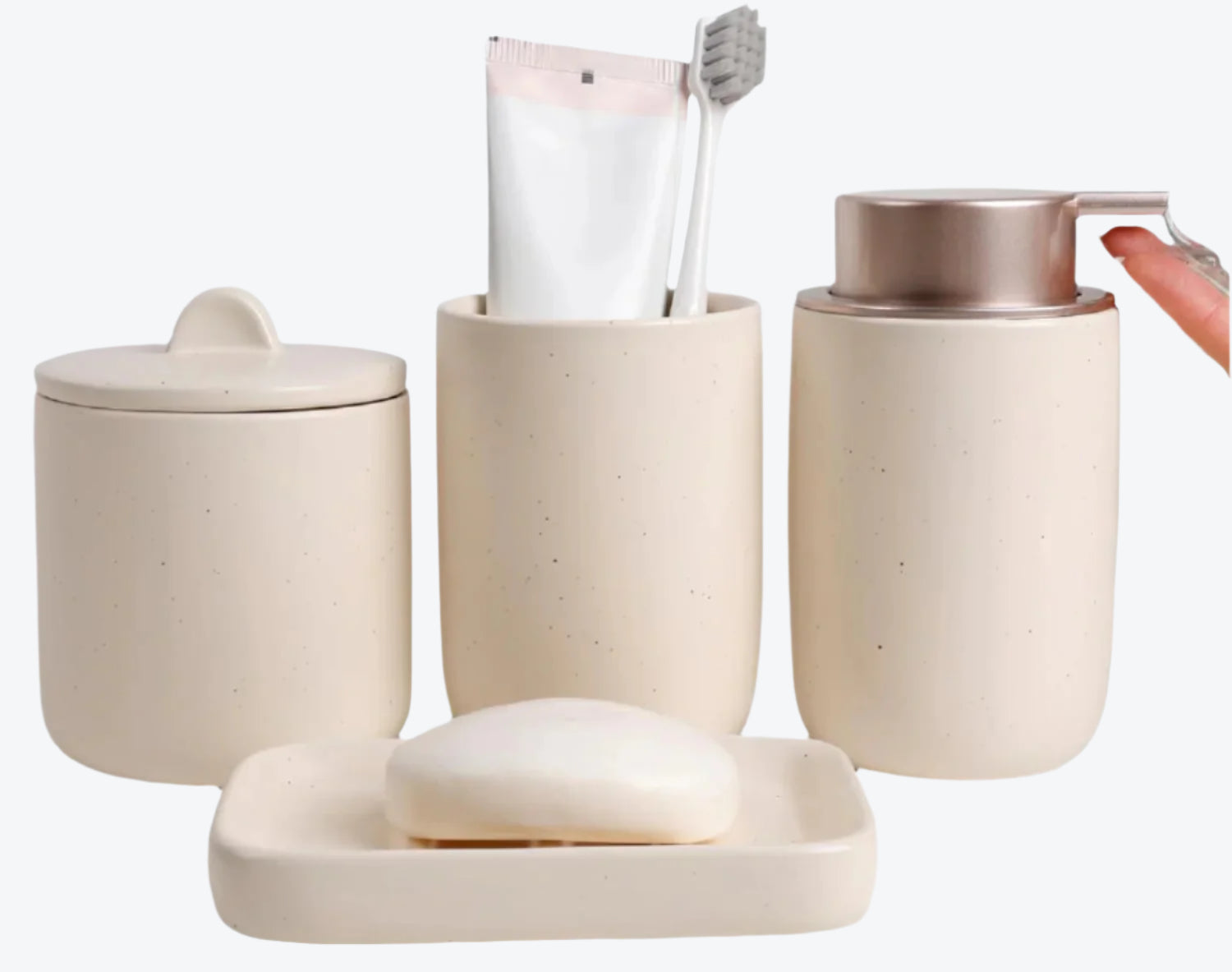 Beige ceramic bathroom set with containers, a soap dish, and a tube of toothpaste.