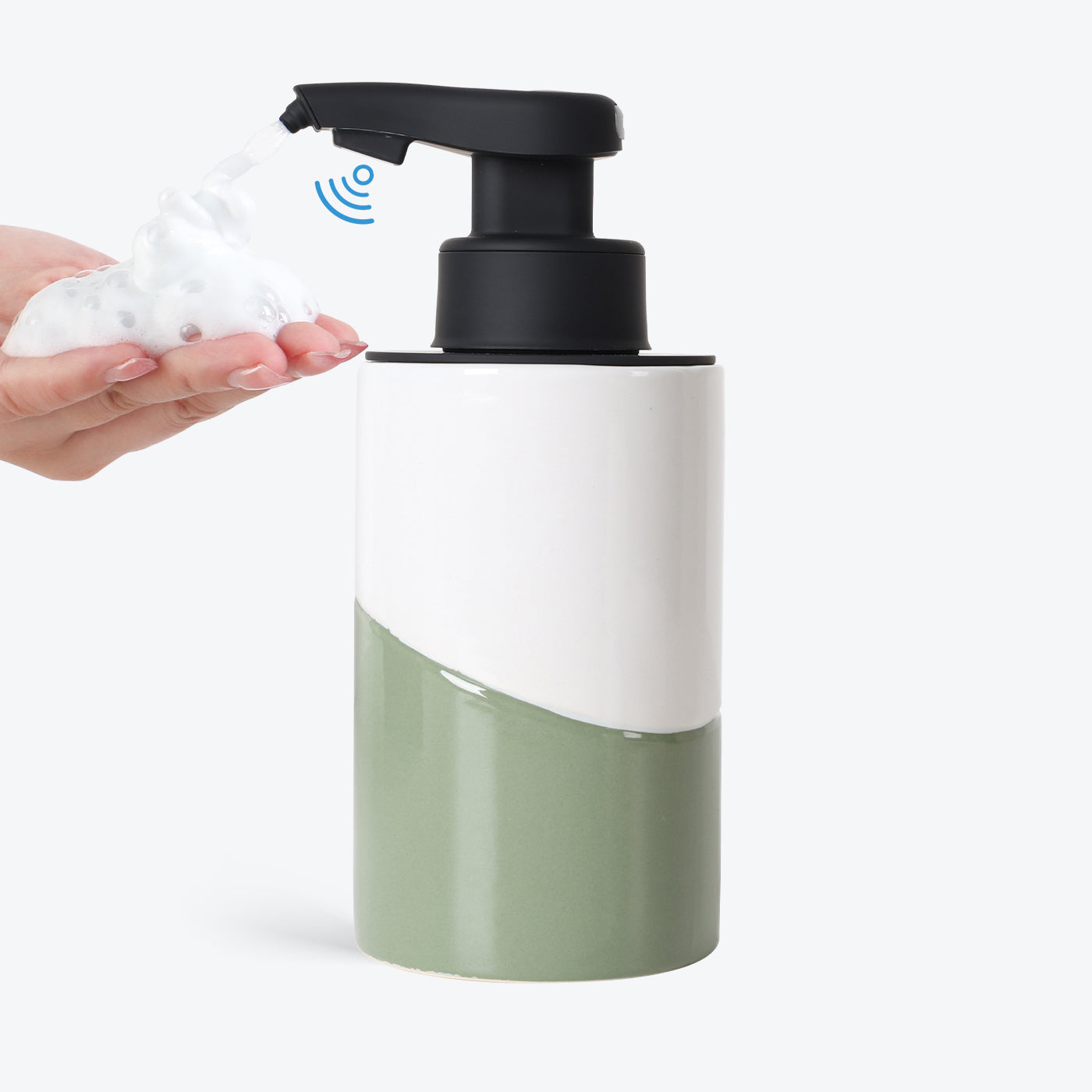 Green and white soap dispenser with pump being used on a white background