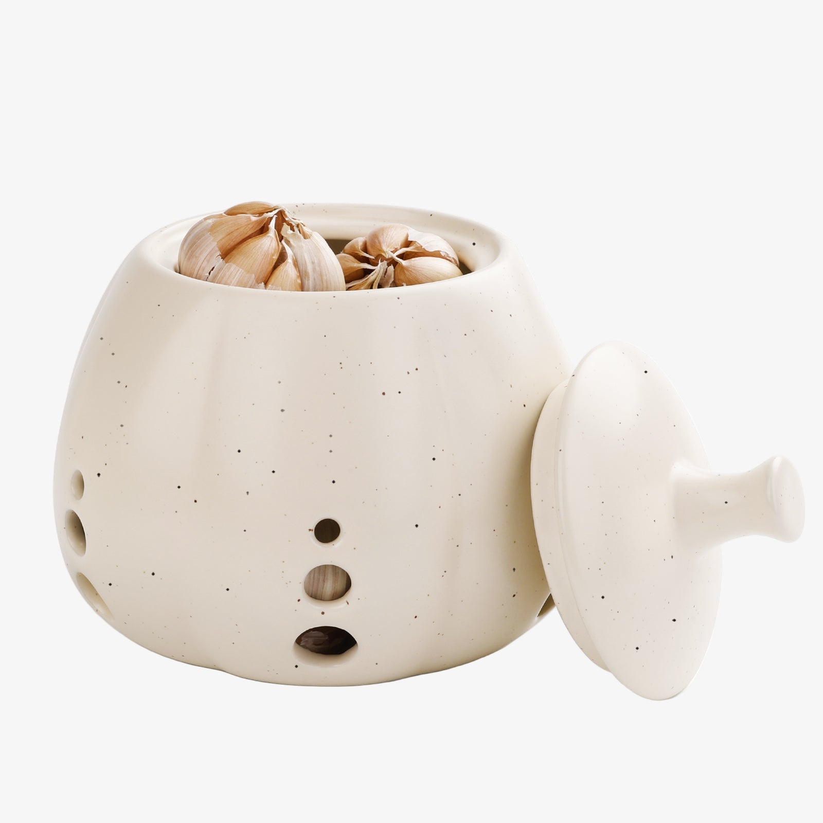 Ceramic container with a snowman design holding garlic on a white background
