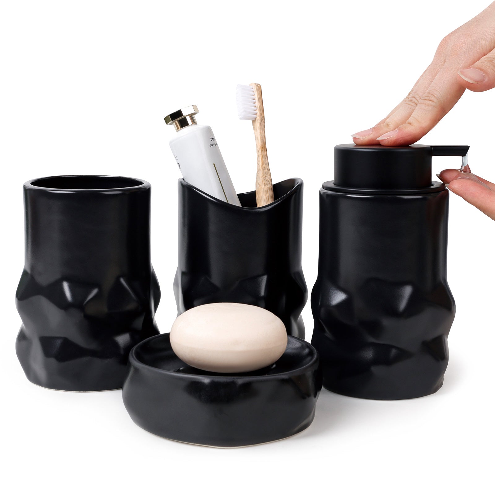 Black bathroom accessory set with cups, soap dish, and bottle opener on a white background