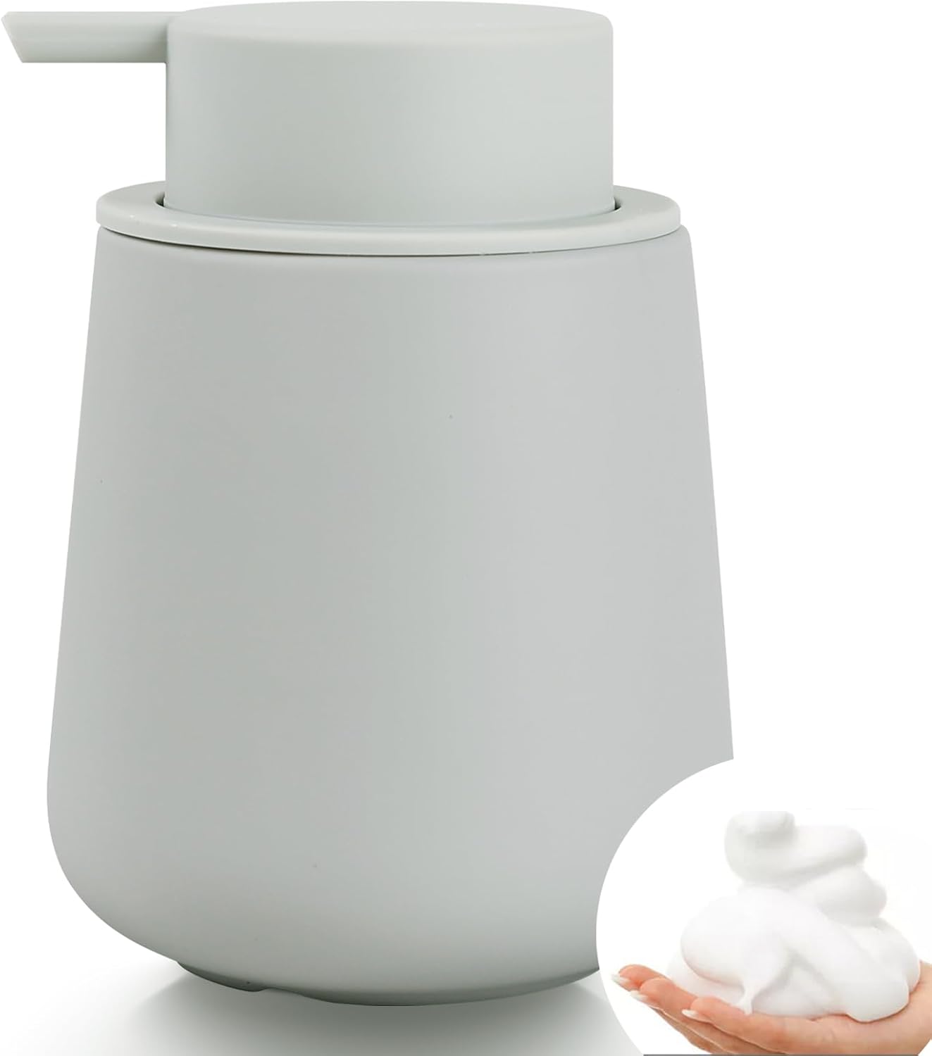 A demonstrative product hero shot of the BosilunLife 12 oz foaming soap dispenser in a muted seafoam grey finish. Crafted from GRS-certified recycled eco-clay with a soft-touch rubber paint coating, the organic vessel features a matching monochromatic wide-head pump. An inset graphic shows the precision-engineered pump dispensing a rich, velvety foam into a hand, highlighting water-saving efficiency and Scandinavian functional design for a modern washroom.