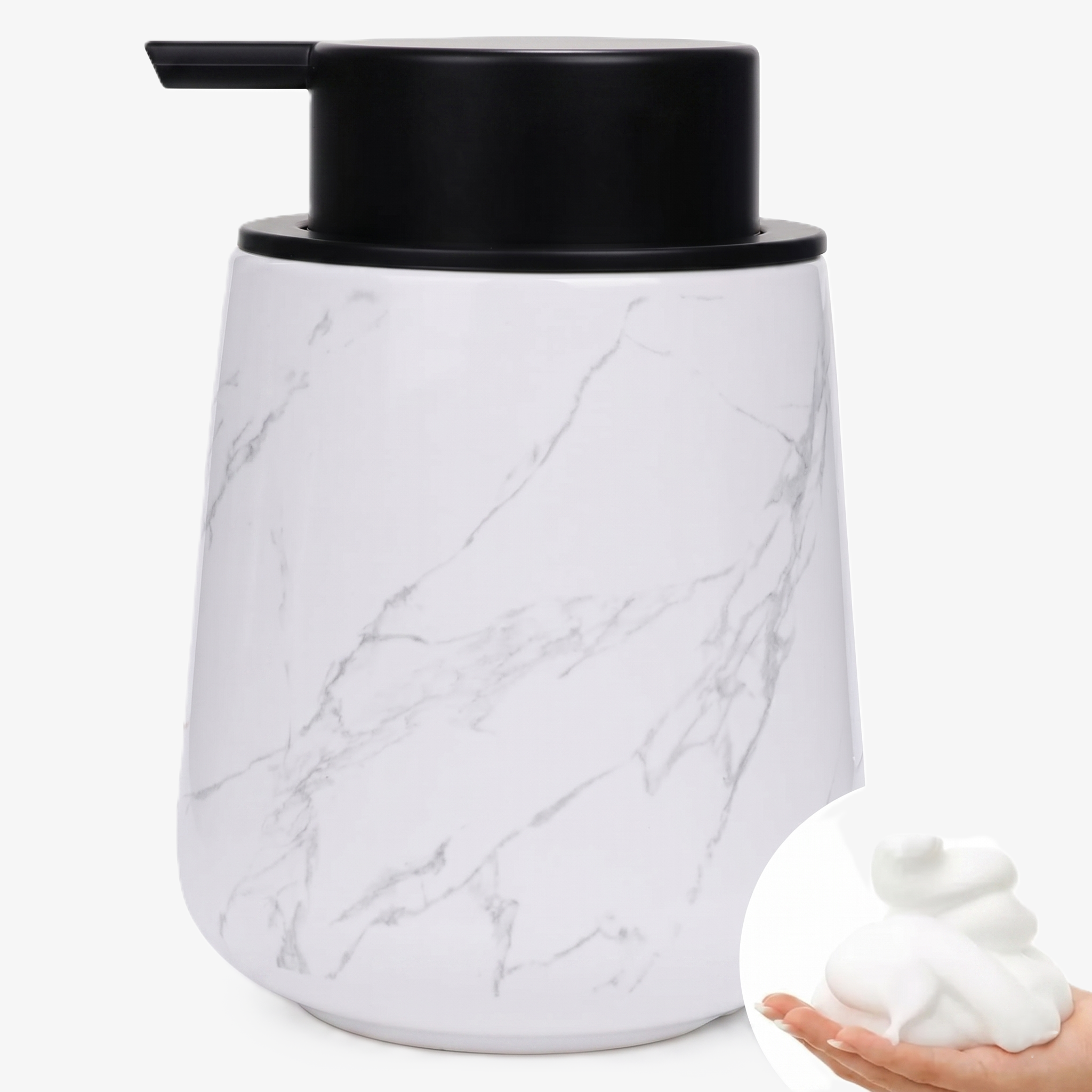 A BosilunLife eco-luxury foaming soap dispenser in a white marble effect finish with grey veining, crafted from GRS-certified recycled ceramic eco-clay. The organic, rounded 12 oz (350ml) vessel is topped with a wide matte black pump and features a circular inset showing rich, velvety white foam held in a hand. This piece reflects Scandinavian functionality and a commitment to a water-saving circular economy, providing a sophisticated organisation solution for a contemporary washroom.