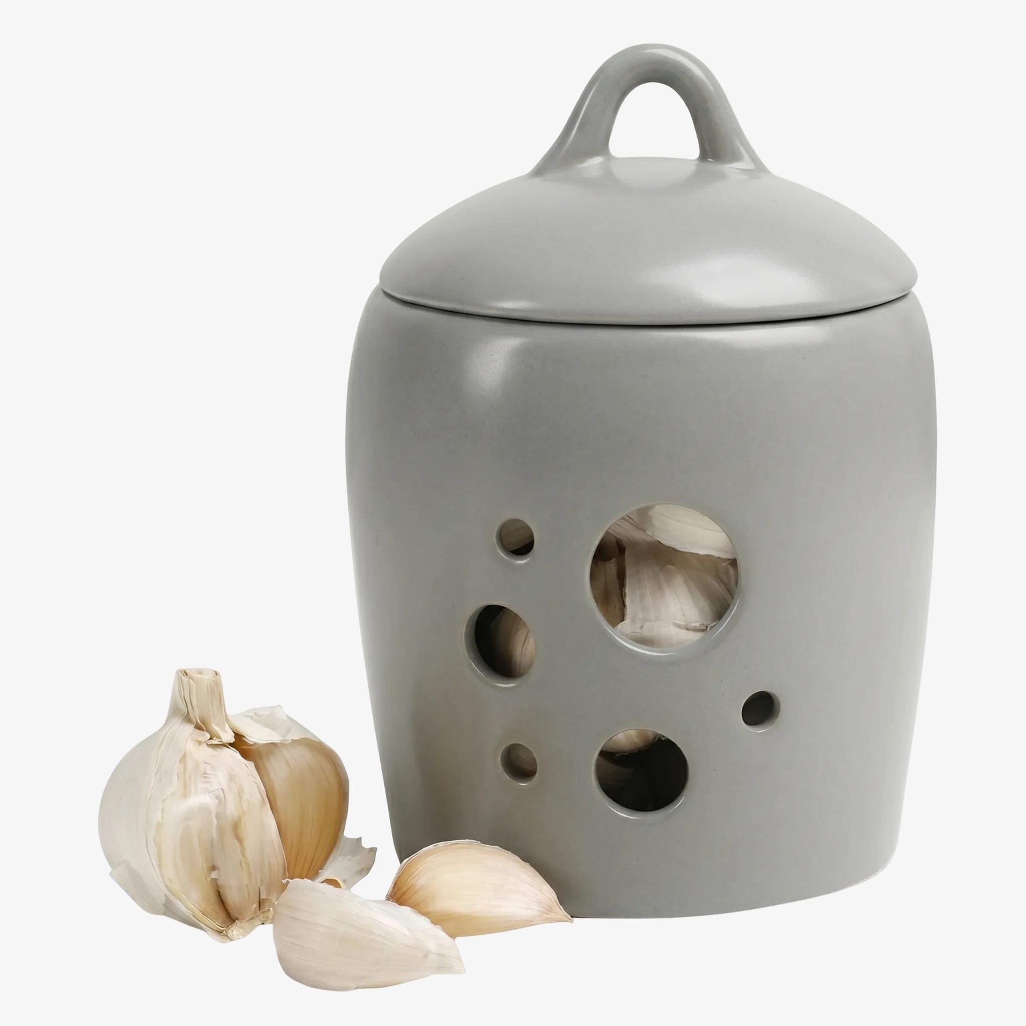 BosilunLife ceramic garlic jar in a smooth, cool grey recycled eco-clay. The light-shielding keeper features a handled lid and circular breathable perforations revealing garlic inside. Styled next to a fresh garlic bulb and loose cloves against a seamless white background, showcasing elegant, odour-resistant grey kitchen worktop storage.