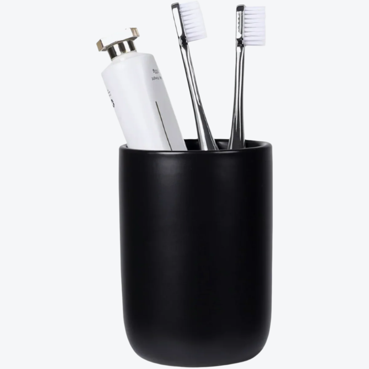Black toothbrush holder with white toothbrushes and a bottle on a white background