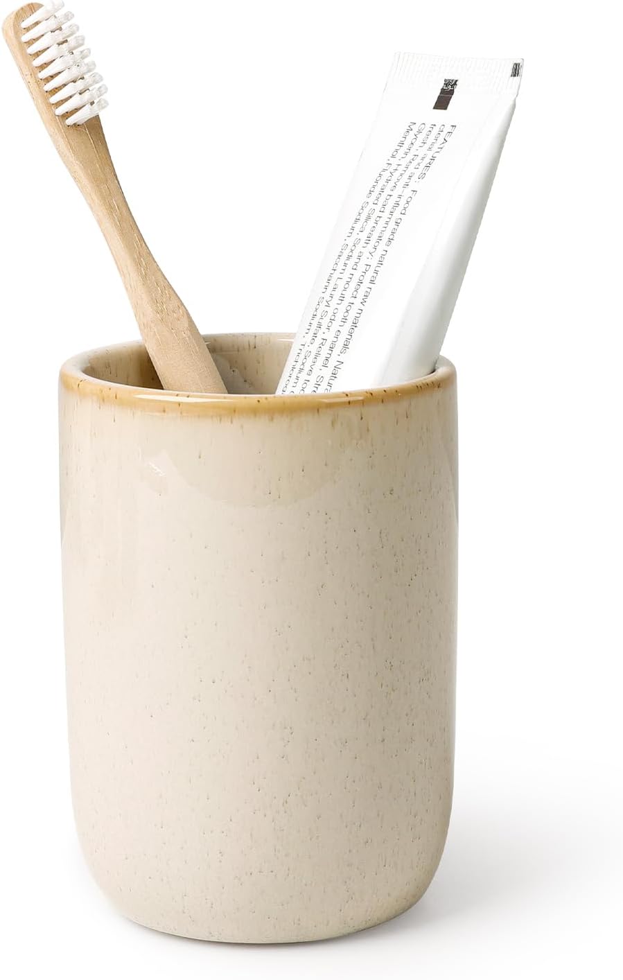 BosilunLife eco-luxury bathroom tumbler and toothbrush holder, crafted from GRS-certified recycled ceramic eco-clay. The organic silhouette features a speckled cream finish with a warm tan-glazed rim, blending Scandinavian functionality with the quiet balance of nature. Styled with a sustainable bamboo toothbrush and white toothpaste tube, it showcases intentional design and a commitment to the circular economy and planetary responsibility.