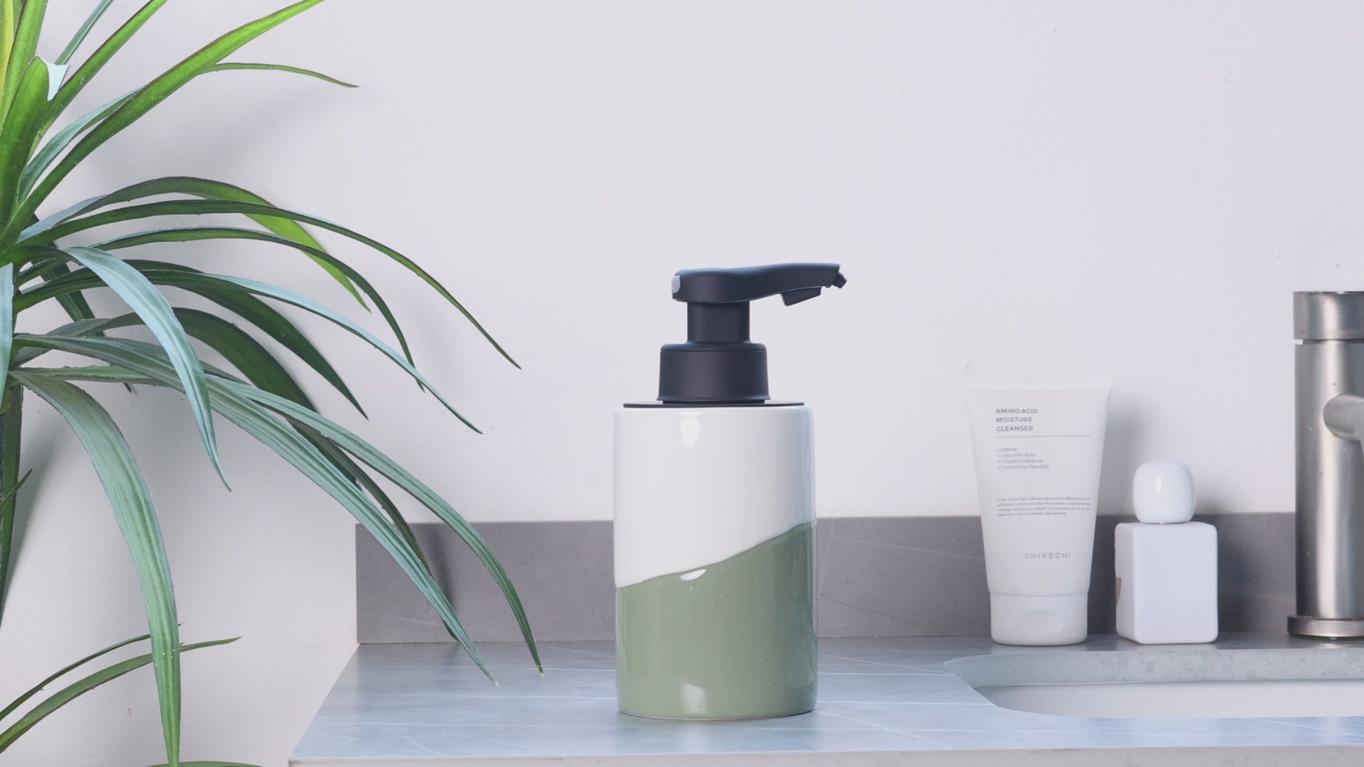 BosilunLife Nordic Garden10 oz automatic soap dispenser in white green, recycled eco-clay, showcase on a countertop.